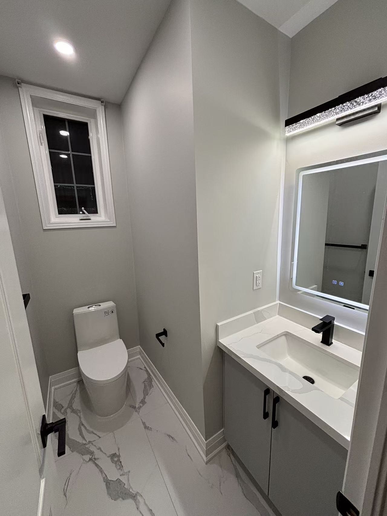 Freestanding bathtub and marble wall tile