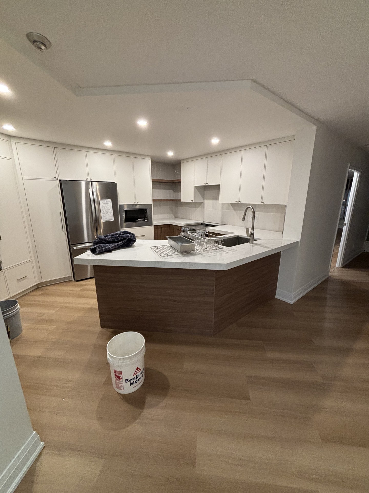 Spacious kitchen walkthrough design by WEIVA Homes